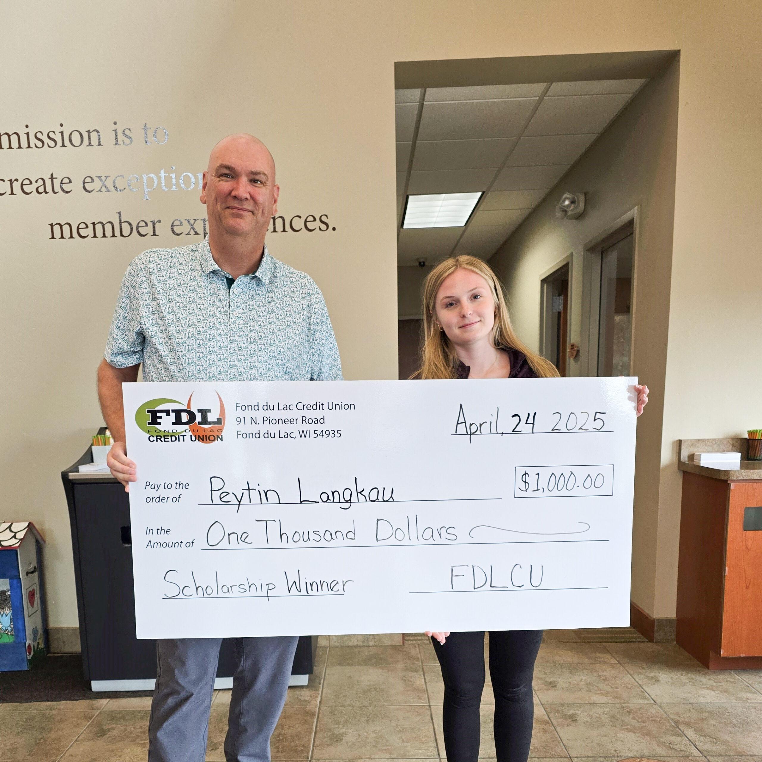 fdlcu-15 Rachel Z 2023 Scholarship Winner holding giant check